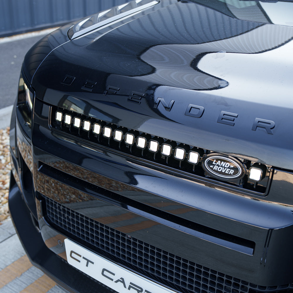 Yellow LED grille for Land Rover Defender L663 2019+ by CT Carbon, showcasing the stylish V3 design on a Defender 110.