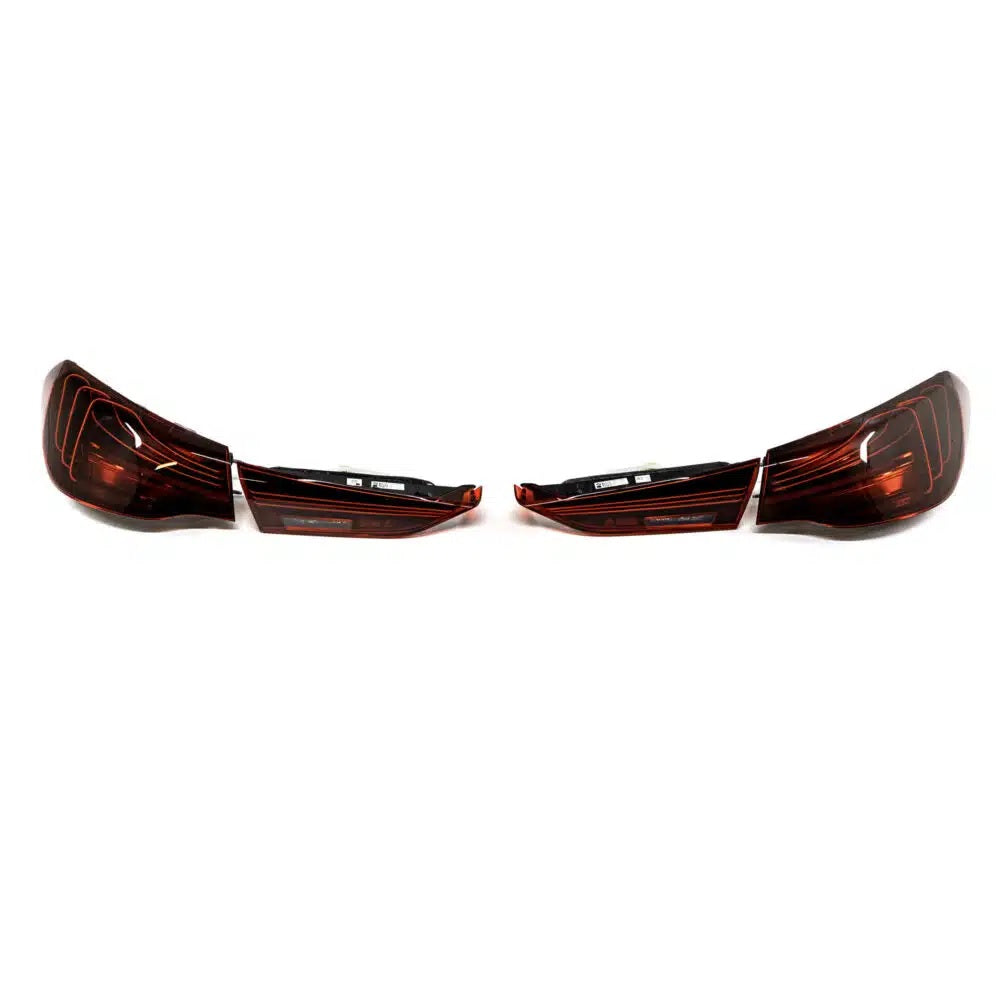Genuine BMW G82 G83 LCI CSL laser tail light set, with sleek LED lighting for BMW M models, showing illuminated tail lights.