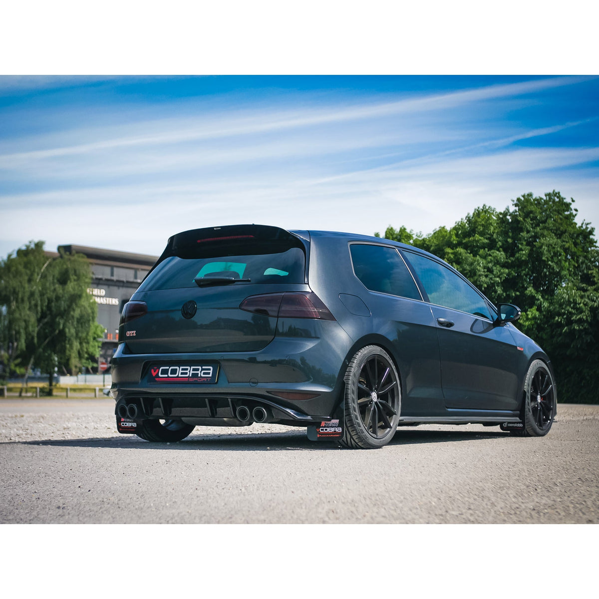 Cobra Sport VW Golf GTI MK7 2.0 TSI quad exit cat back performance exhaust system installed on a car.