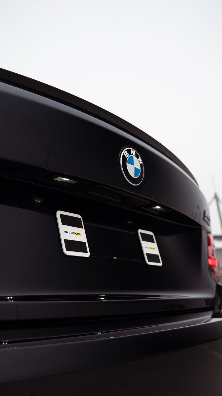 Hold My Plate front bumper magnetic number plate holder kit mounted on a vehicle's front bumper.