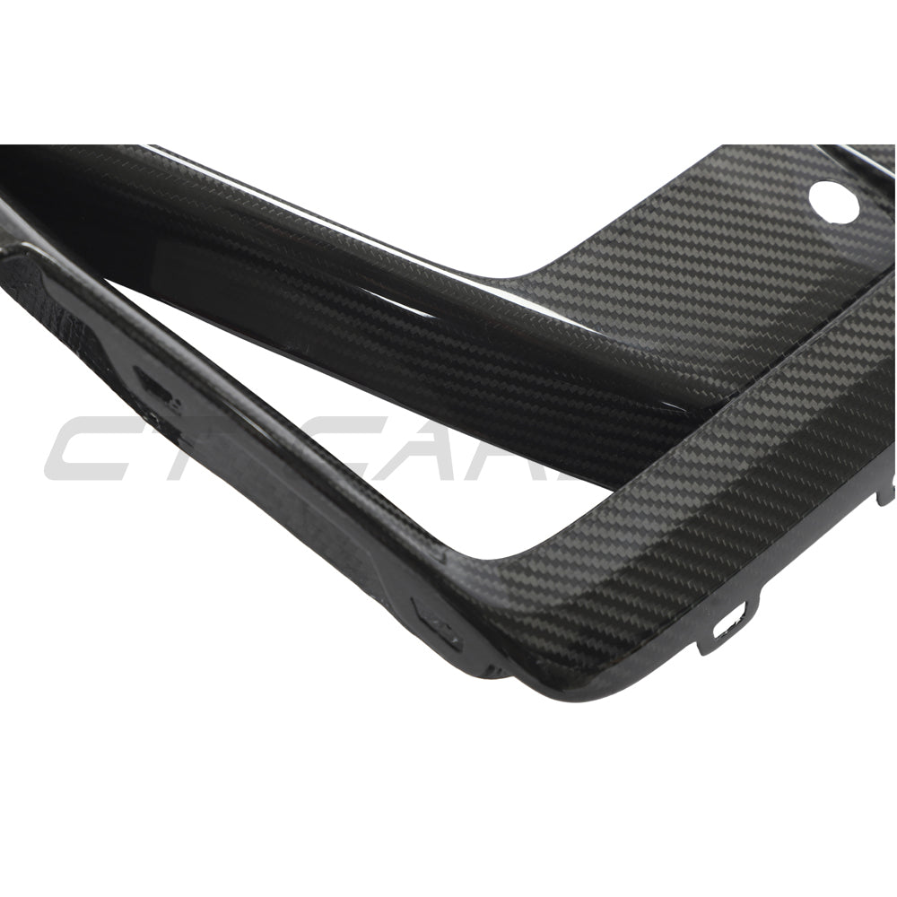 BMW X3M/X4M F97/F98 LCI 2022+ Carbon Fibre Front Bumper Trim accessory by CT Carbon, showing close-up of sleek carbon fiber finish.