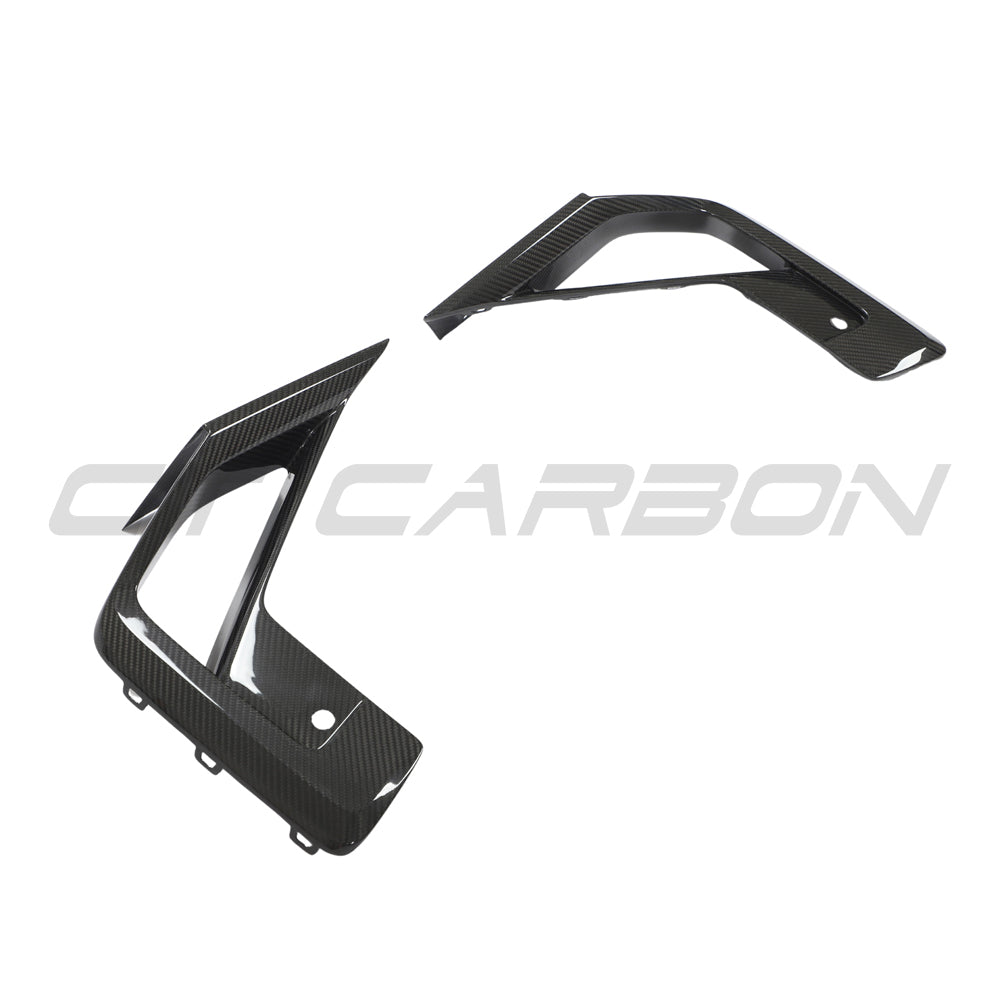 BMW X3M/X4M F97/F98 LCI 2022+ carbon fibre front bumper trim accessory by CT Carbon, showcasing sleek, textured carbon finish.