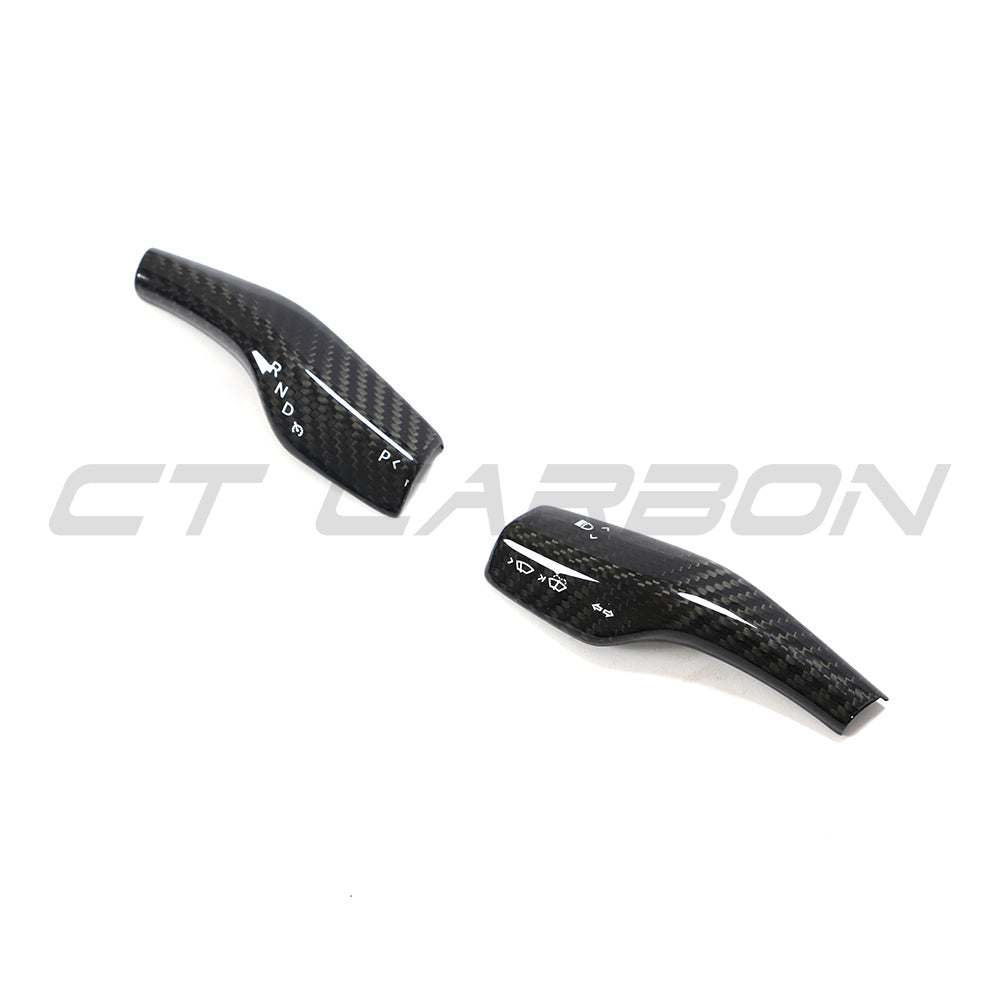 Tesla Model 3 and Y 2017+ carbon fiber stalk cover by CT Carbon, close-up view of sleek, textured automotive accessory.