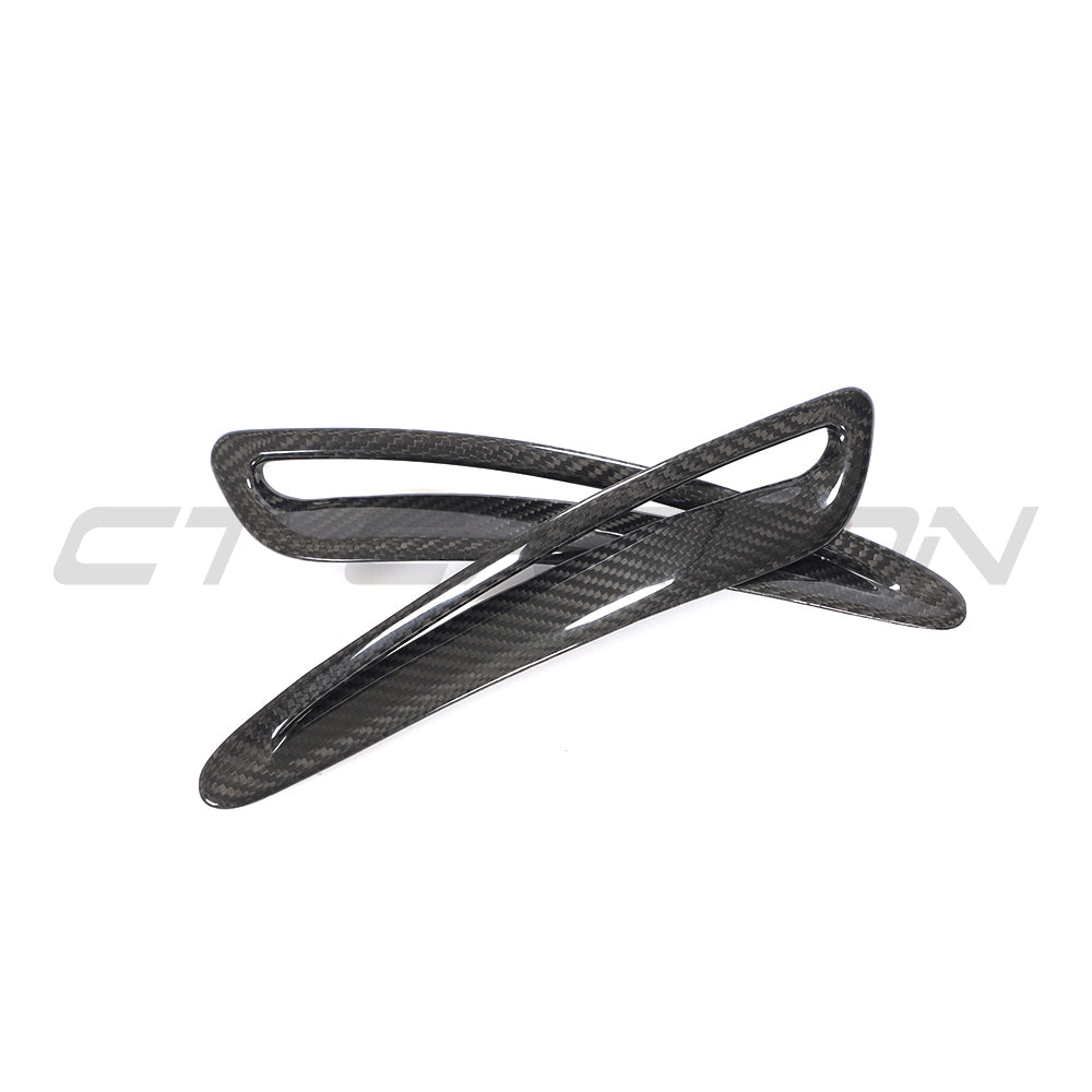 Carbon fiber hood trim for Toyota Supra 2019+ A90 by CT Carbon, shown on the car's hood with a sleek finish.