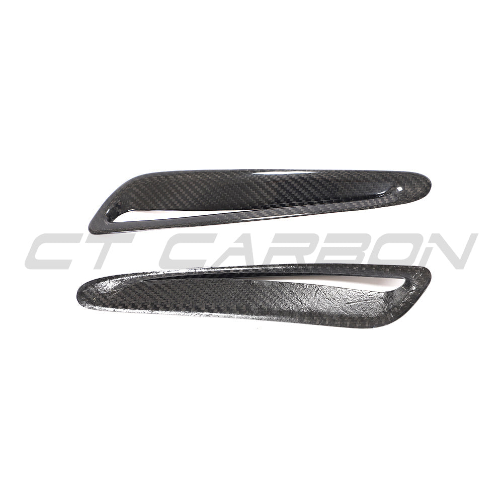 Toyota Supra 2019+ A90 carbon fiber hood trim by CT Carbon, close-up of sleek, lightweight automotive accessory.