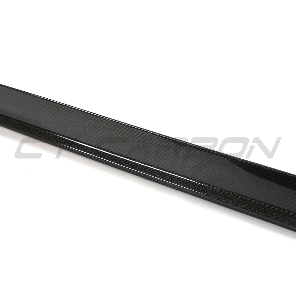 BMW 4 Series G26 and i4 carbon fibre side skirts by CT Carbon, showcasing sleek, lightweight automotive styling.