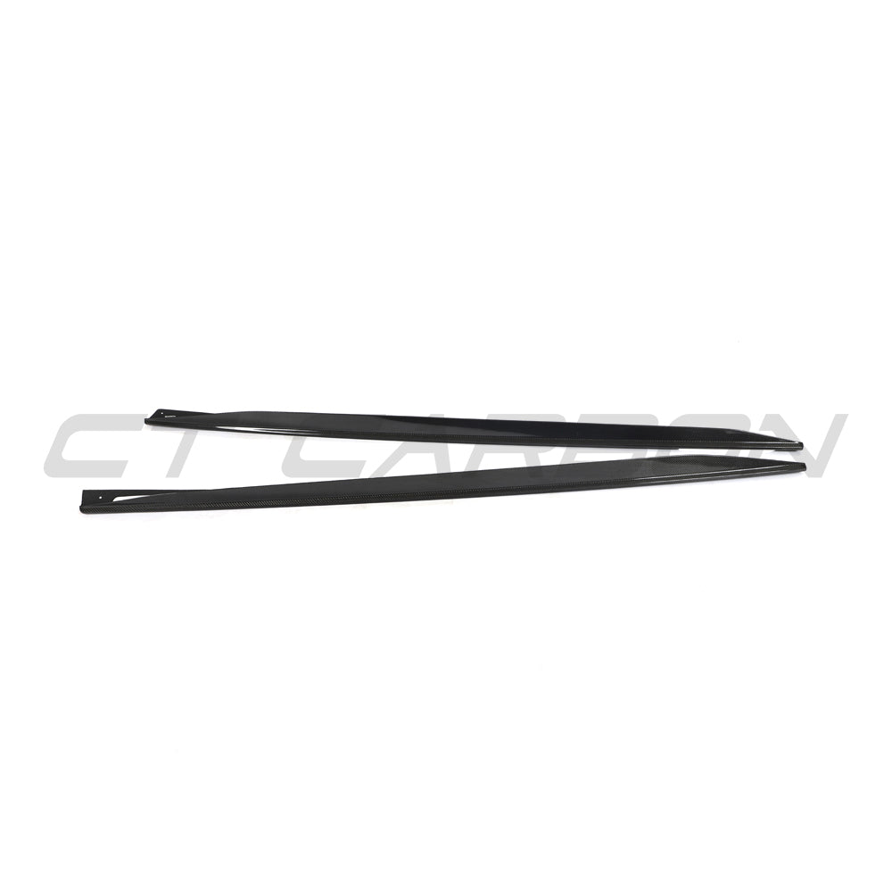 BMW 4 Series G26 and i4 carbon fibre side skirts by CT Carbon, showing sleek, textured aerodynamic design for sporty look.