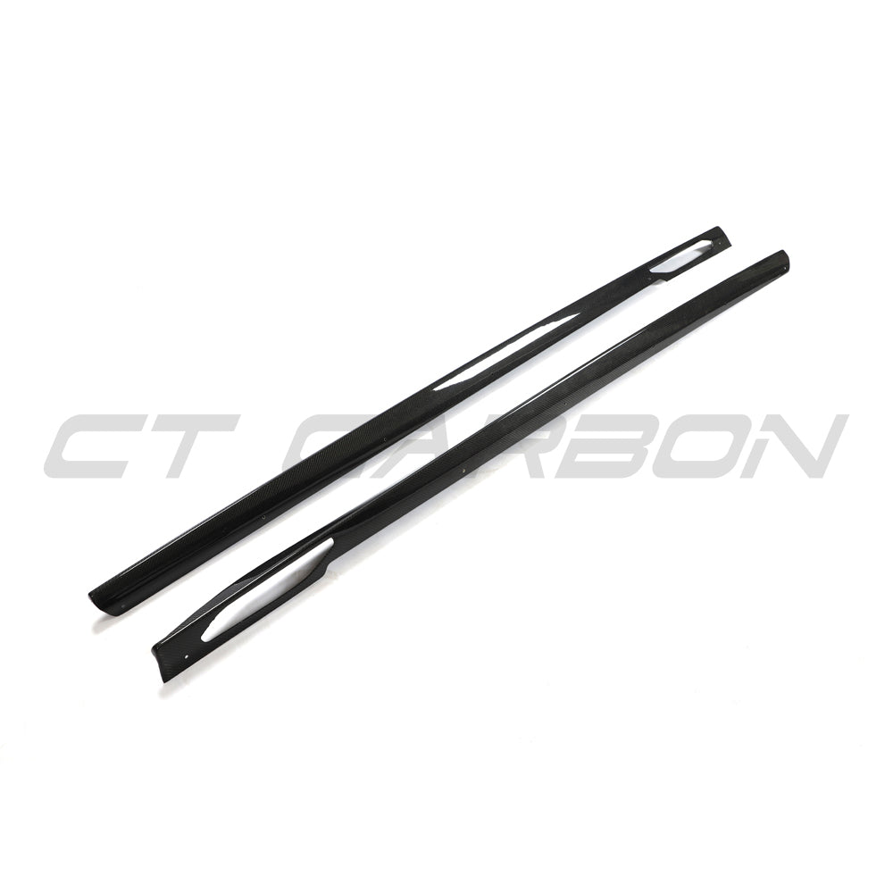 BMW 4 Series G26 and i4 carbon fibre side skirts by CT Carbon shown on a vehicle, highlighting sleek, lightweight aerodynamic design.