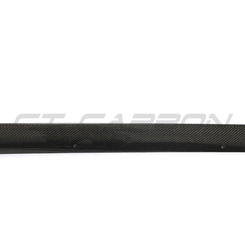 BMW 4 Series G26 and i4 carbon fibre side skirts by CT Carbon, featuring sleek, aerodynamic design for enhanced vehicle style.