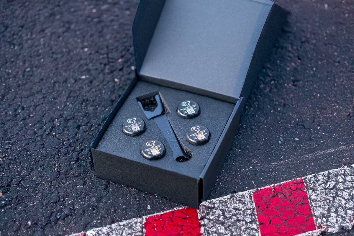 OnTrack External TPMS Tyre Pressure Sensors installed on a vehicle tire for accurate pressure monitoring.
