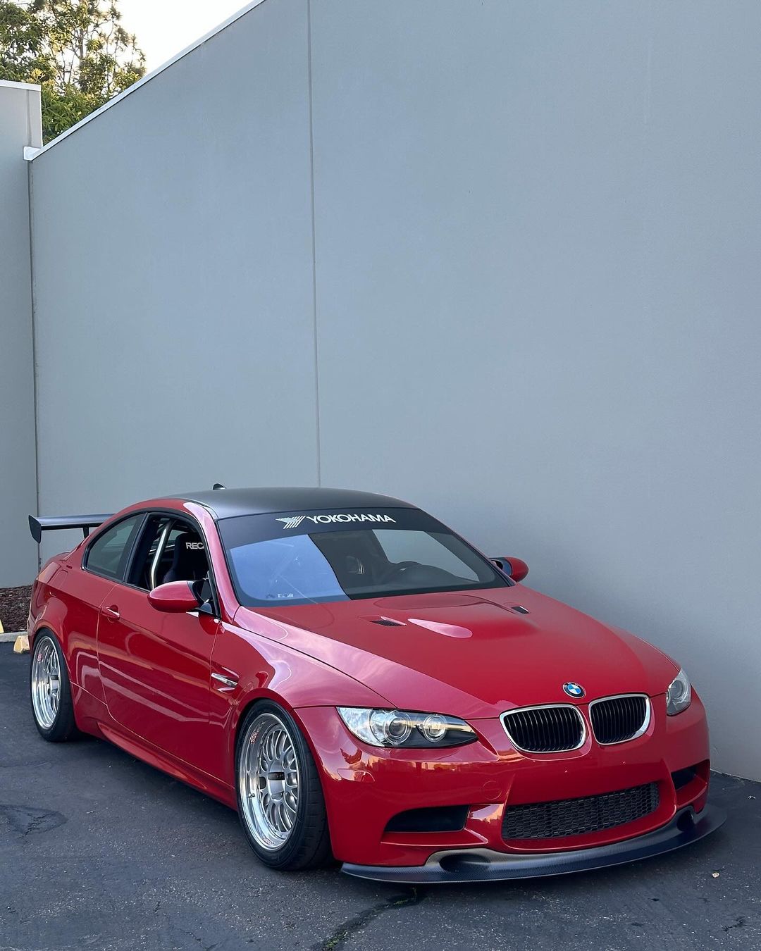Ridgeline Motorsport E9X M3 GT4 V1 front splitter, a sleek car spoiler with aerodynamic design, shown on a white background.