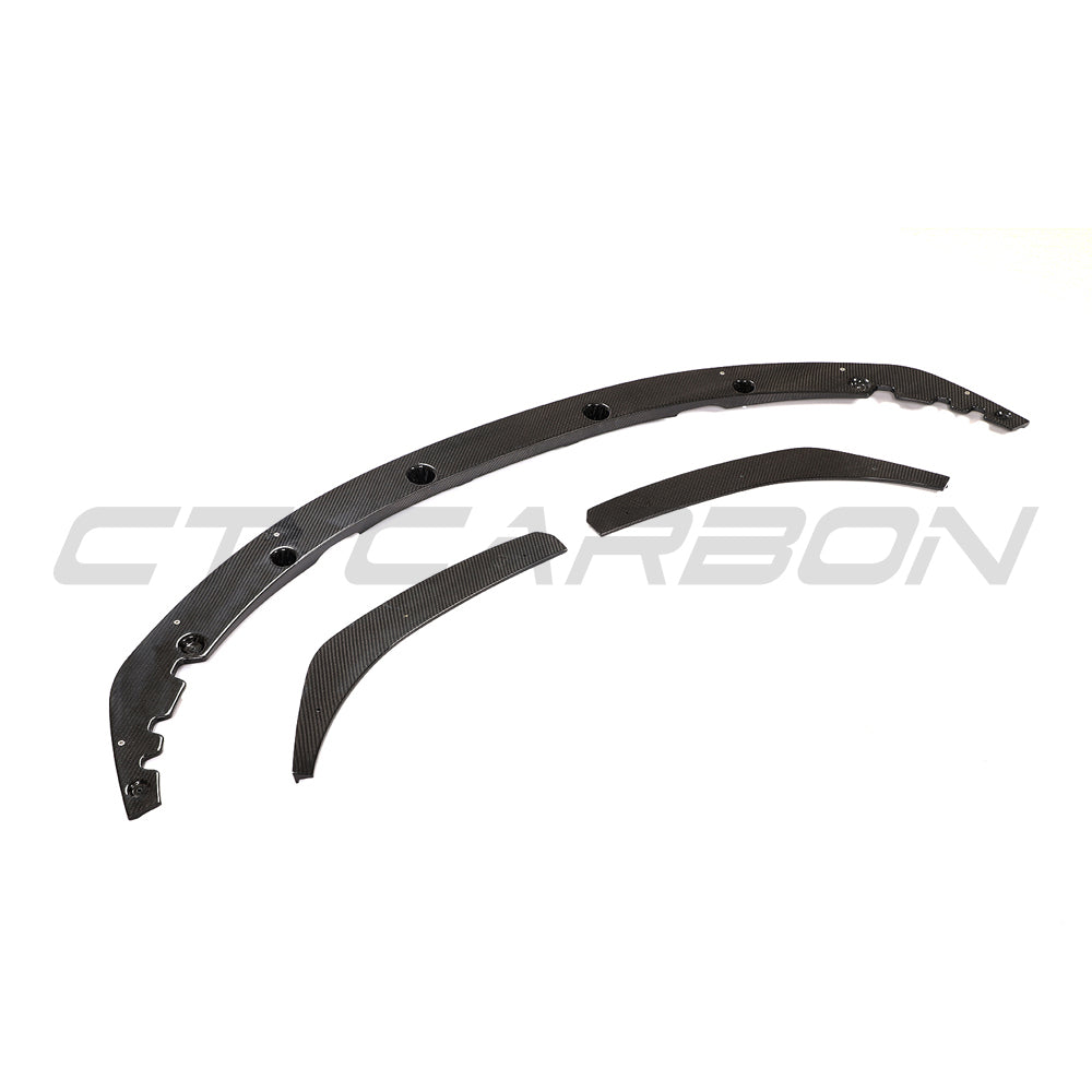 BMW G22 4 Series 2020+ CT Carbon V6 carbon fibre kit installed on the car, showcasing sleek, glossy carbon fibre accents and details.