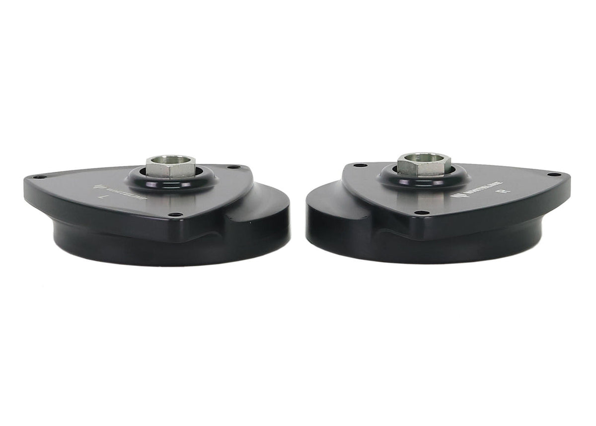 Whiteline front strut mount kit with bushes, showing close-up of the rubber and metal components for vehicle suspension.