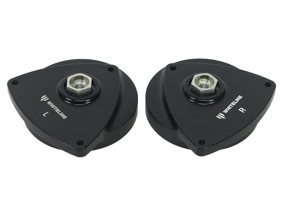 Whiteline front strut mount kit showing automotive bushings and mounting components for suspension upgrade.