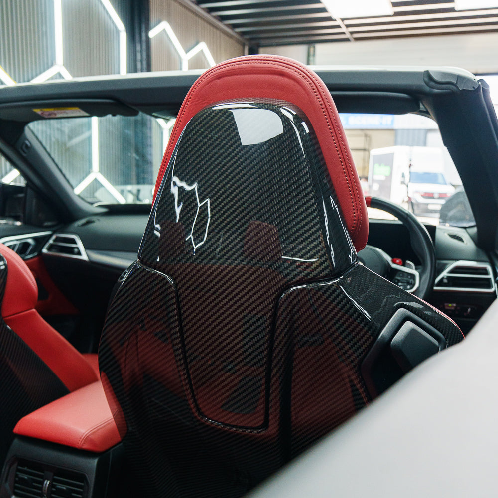 BMW GXX/F9X/G42 coupe and convertible full carbon fibre seat backs by CT Carbon, showing sleek, lightweight carbon fiber material.
