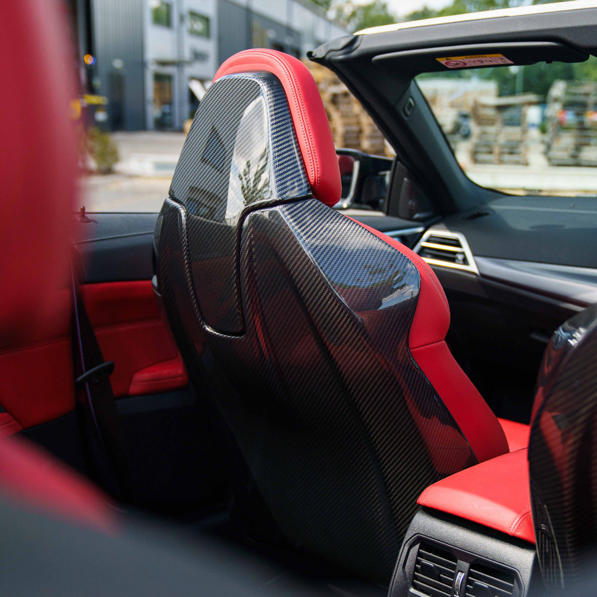 BMW GXX/F9X/G42 coupe and convertible full carbon fibre seat backs by CT Carbon, showcasing sleek, lightweight automotive interior accessories.