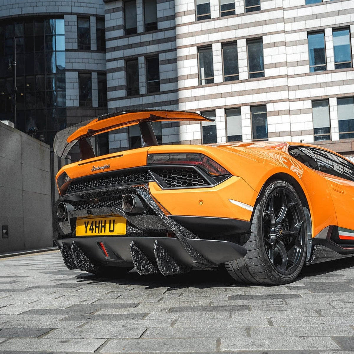 Lamborghini Huracan Performante diffuser extensions by CT Design, showcasing carbon fiber details on the vehicle's rear diffuser.