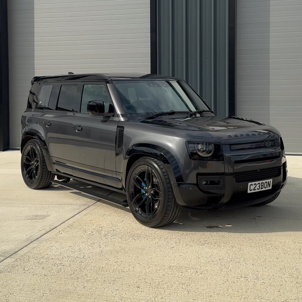 CT Carbon electric fold-out side steps for Land Rover Defender L663 110, durable accessory for easy vehicle access.