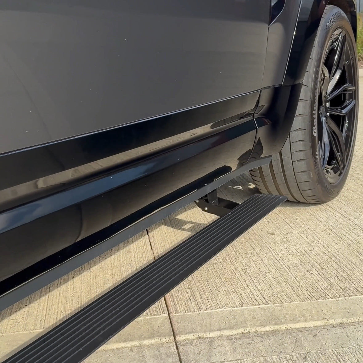 CT Carbon electric fold-out side steps for Land Rover Defender L663 110, durable accessories for easy vehicle access.