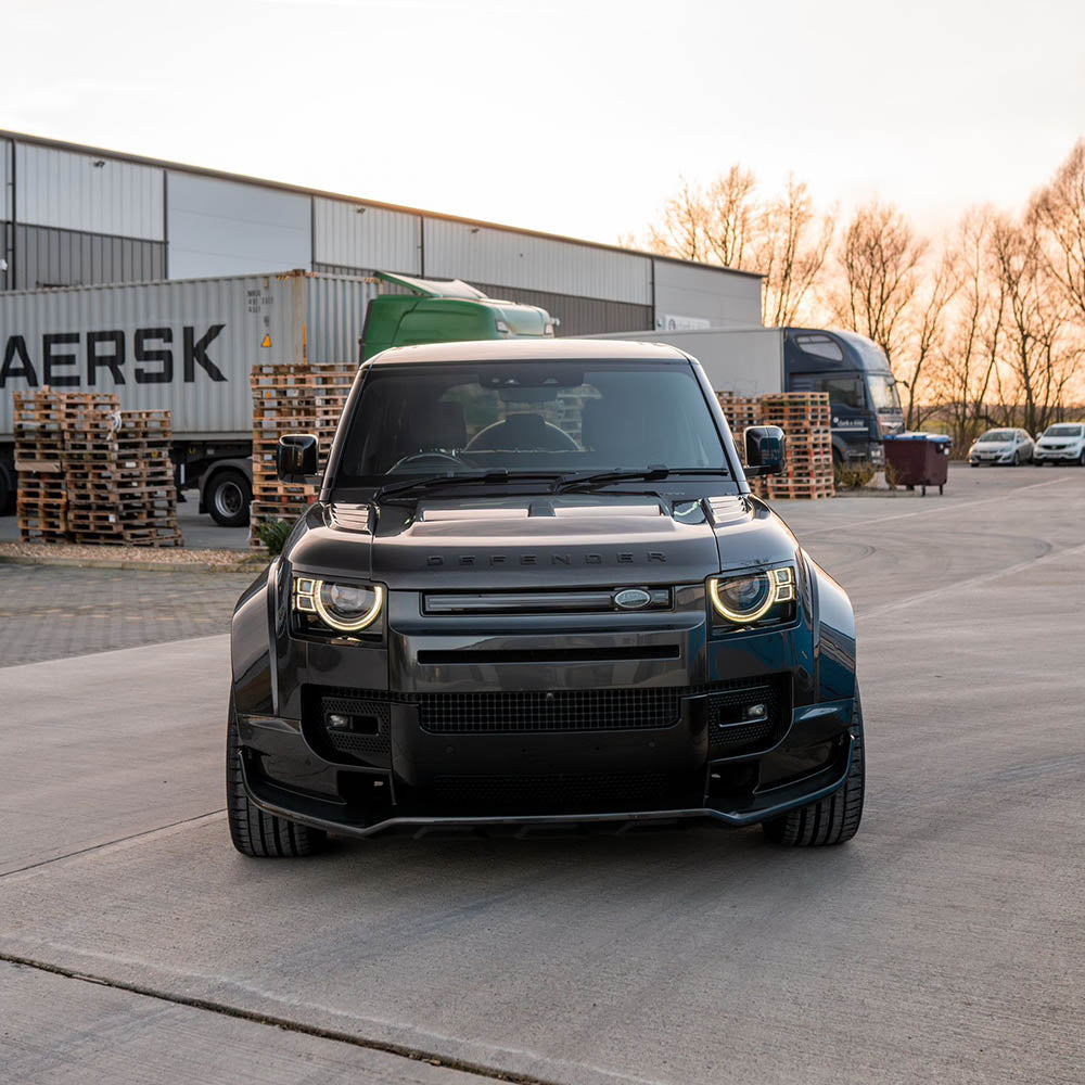 Carbon fiber wide arch kit for Land Rover Defender L663 110 by CT Design, showing the sleek, full carbon fiber exterior modifications.