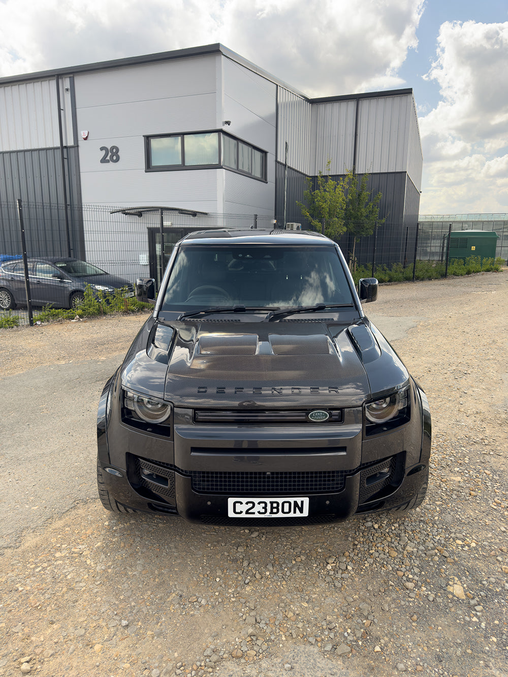 Carbon fiber Land Rover Defender L663 bonnet with SV style design, featuring a sleek, lightweight upgrade for 90, 110, or 130 models.
