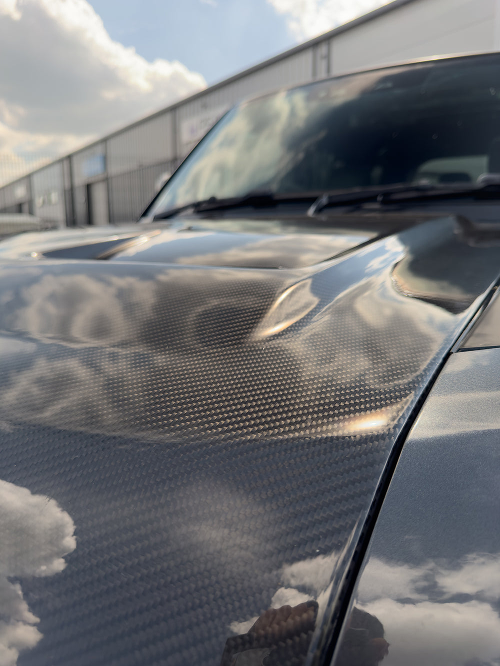 Carbon fiber bonnet for Land Rover Defender L663 SV Style, featuring sleek design and lightweight construction by CT Carbon.