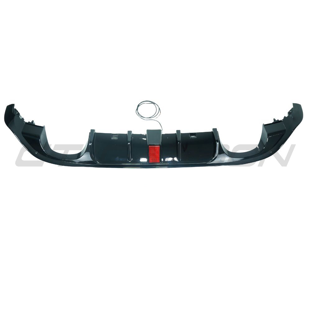 Gloss black Volkswagen Golf R MK7.5 diffuser with integrated LED lights, made by CT Carbon, shown from the rear angle.