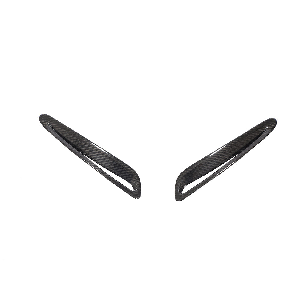 Toyota Supra 2019+ A90 carbon fiber hood trim by CT Carbon, close-up view showing sleek black finish and textured surface.