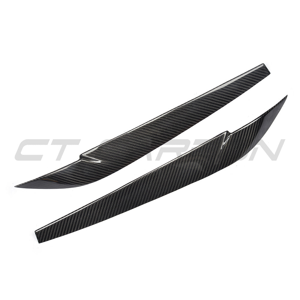 BMW F15/F16 X5/X6 carbon fibre headlight eyebrows accessory by CT Carbon, shown on the vehicle's front headlights.