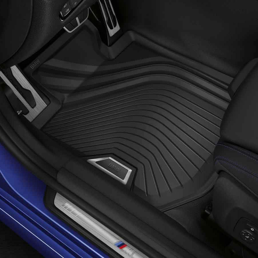 Genuine BMW rubber all-weather floor mats for G22 G82 models, designed to protect vehicle floors from dirt and moisture.