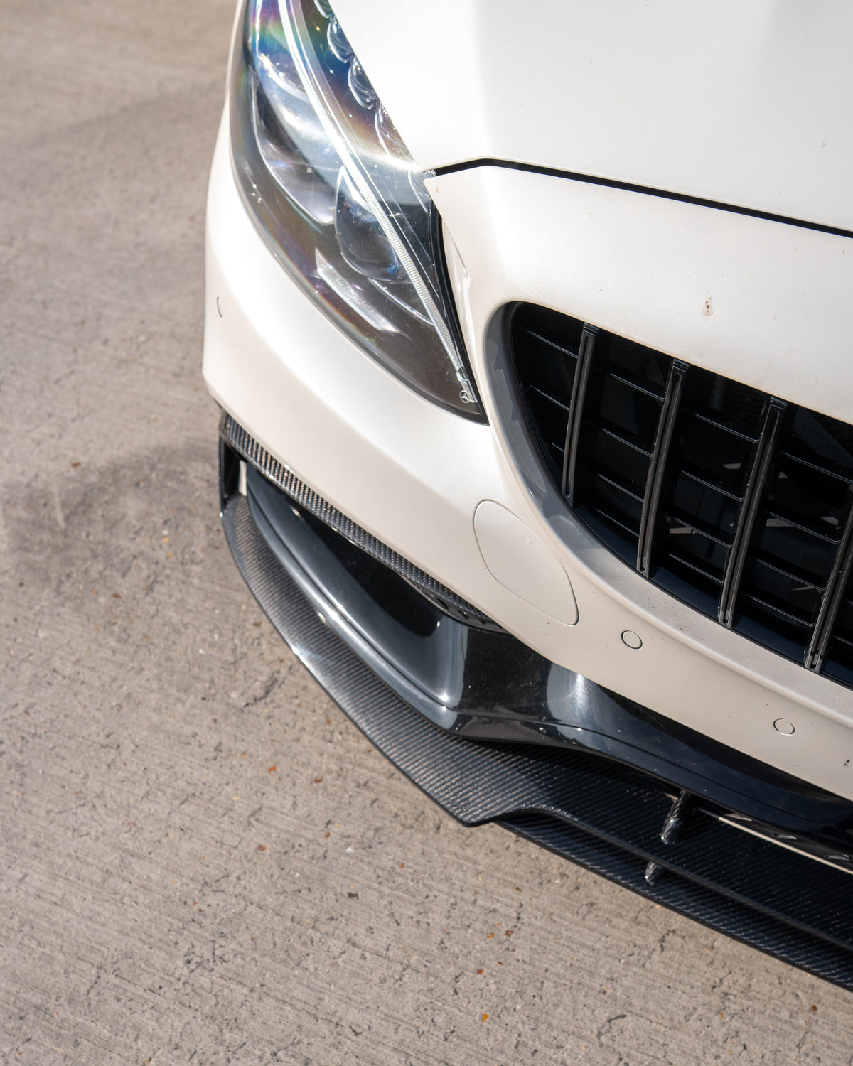 Mercedes C63 W205 saloon and estate car carbon fibre splitter by CT Carbon, featuring a sleek V1 B-style design.
