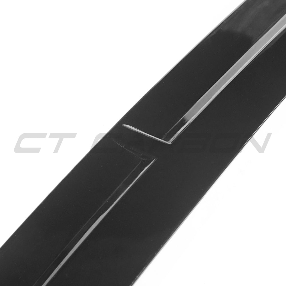 Gloss black Mercedes W118 CLA B Style splitter by CT Carbon, showing its sleek aerodynamic design and mounting details.