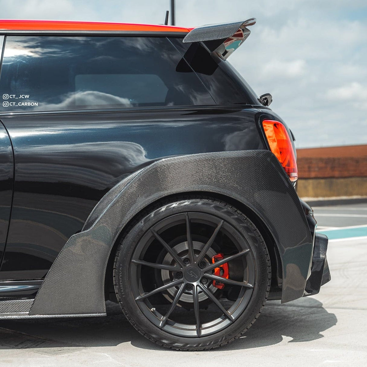 Mini Cooper S F56 JCW Sport Pack wide arch kit with carbon fibre finish, featuring sleek, aerodynamic design and custom fit for enhanced performance.