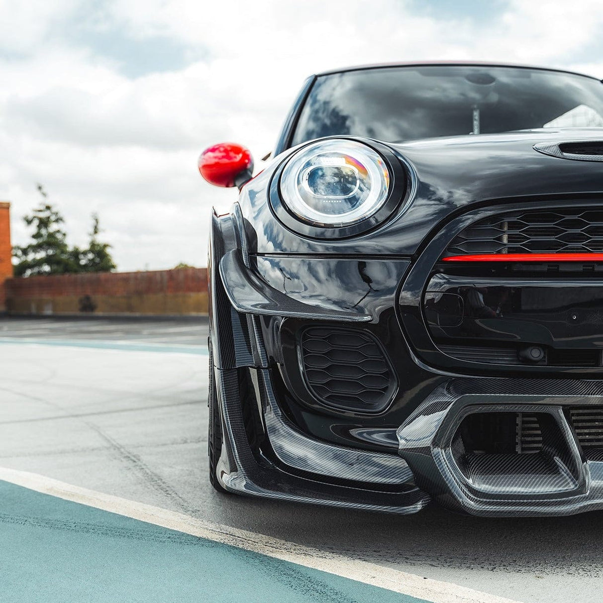 Carbon fiber wide arch kit for MINI Cooper S F56 JCW Sport Pack by CT Carbon, featuring sleek, aerodynamic design and enhanced wheel arches.