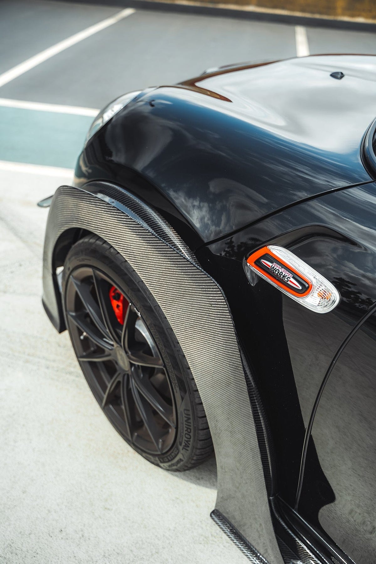 Carbon fiber wide arch kit for MINI Cooper S F56 JCW Sport Pack by CT Carbon, showcasing sleek, aerodynamic design and precise fit.