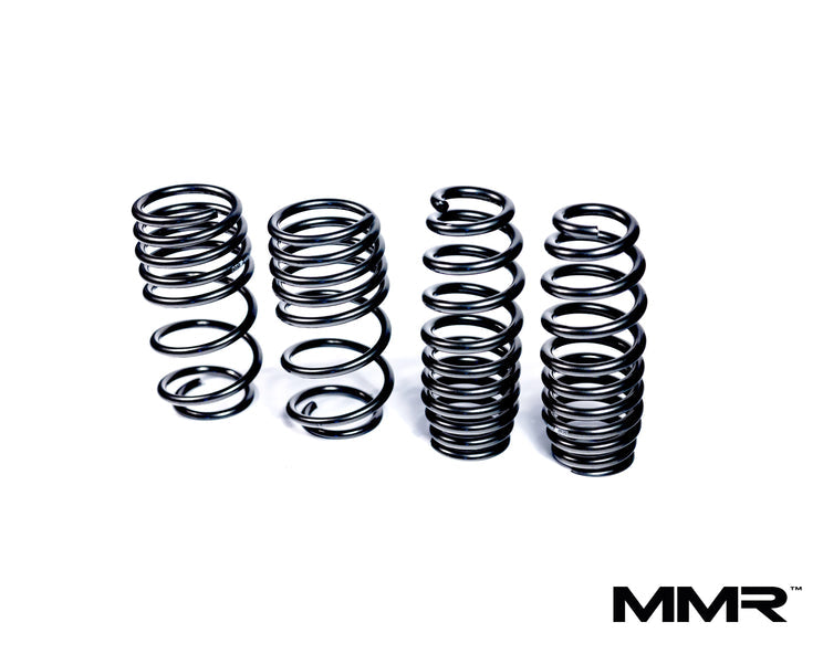 MMX Performance lowering springs for BMW M4 F82, showing the product logo on a black spring coil.