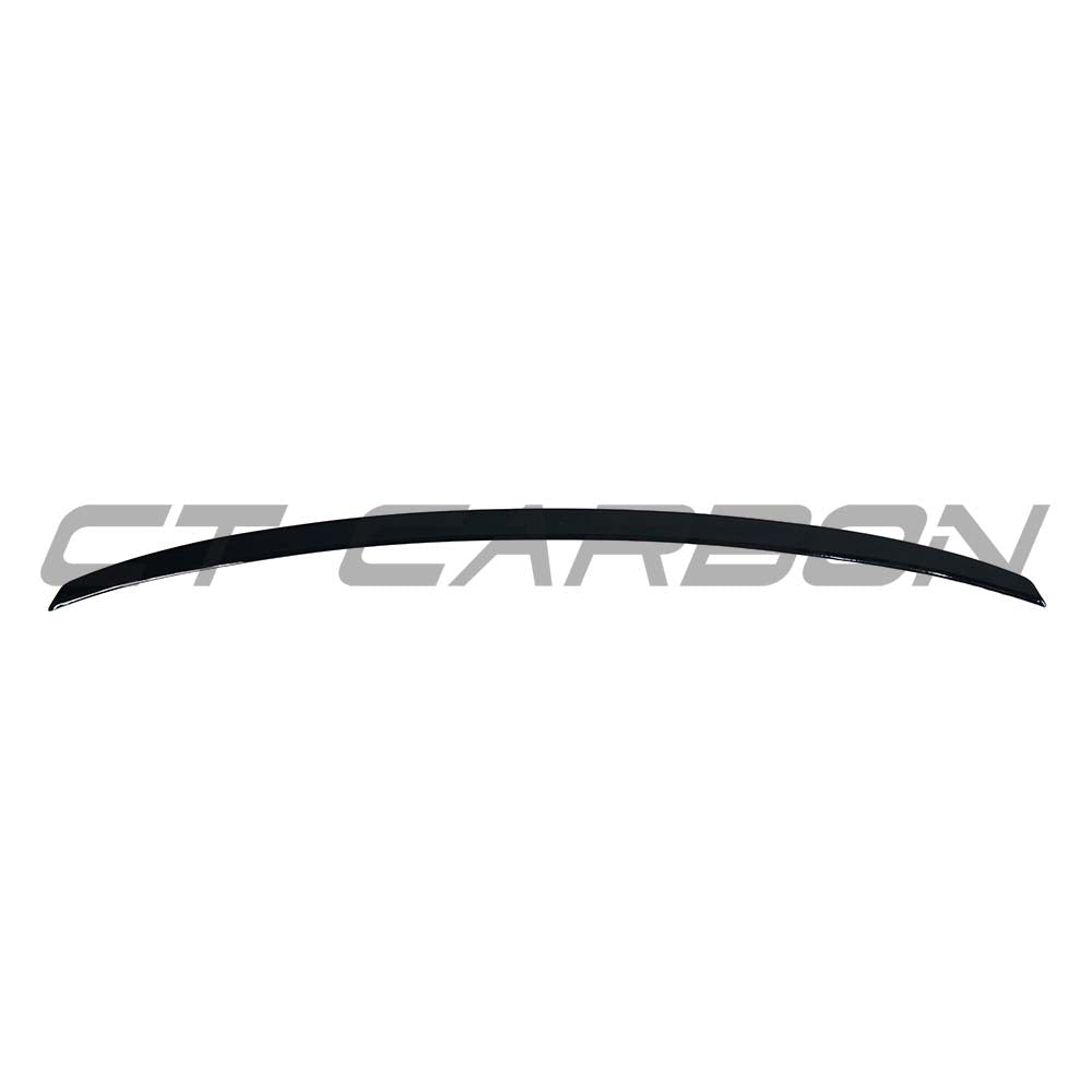 BMW 4 Series G22 gloss black spoiler by CT Carbon, showing the sleek aerodynamic design on the vehicle's rear.