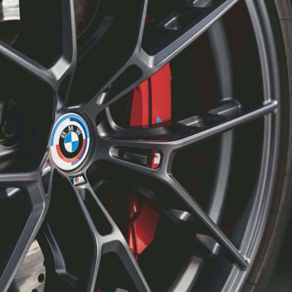 Genuine BMW 50 Years of M front and rear badge emblems for X5 G05, sleek metallic M performance badges with detailed design.
