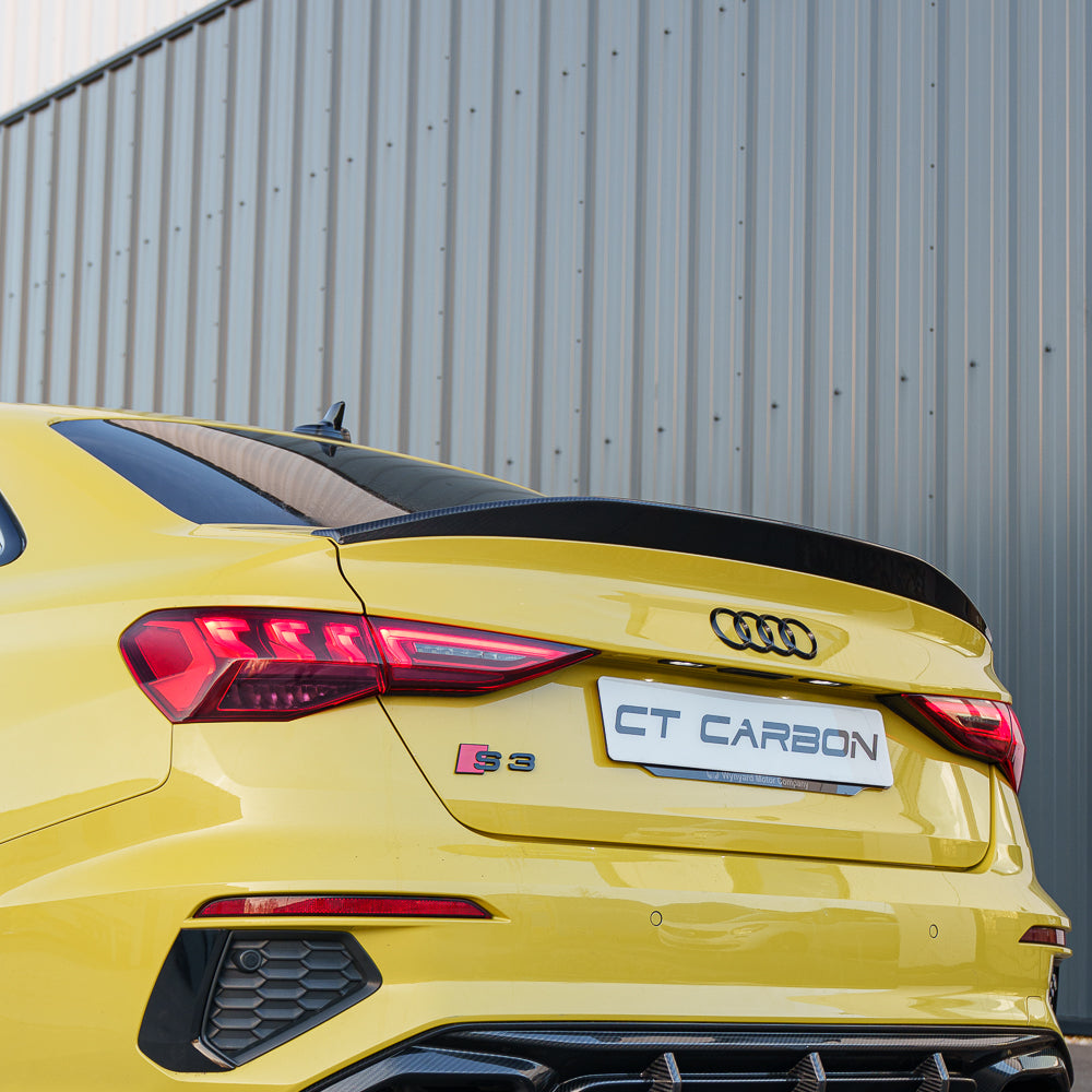 Python yellow Audi S3 saloon with CT Carbon V2 spoiler, showcasing a sleek carbon fiber spoiler on the 2022+ Audi A3/S3/RS3 8Y.