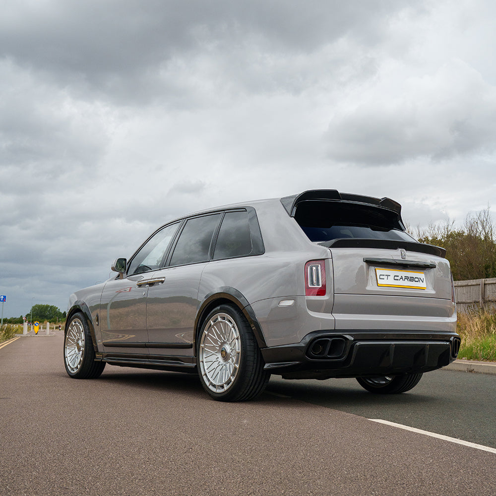 Carbon fiber diffuser and tips splitter for Rolls-Royce Cullinan by CT Carbon, showcasing sleek styling and high-performance design.