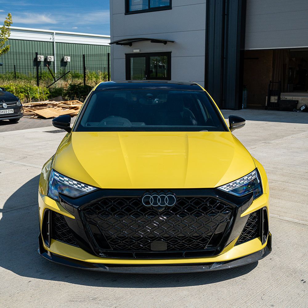 Audi RS3 8Y 2025+ carbon fibre splitter by CT Carbon, showcasing sleek aerodynamic design on the front bumper.
