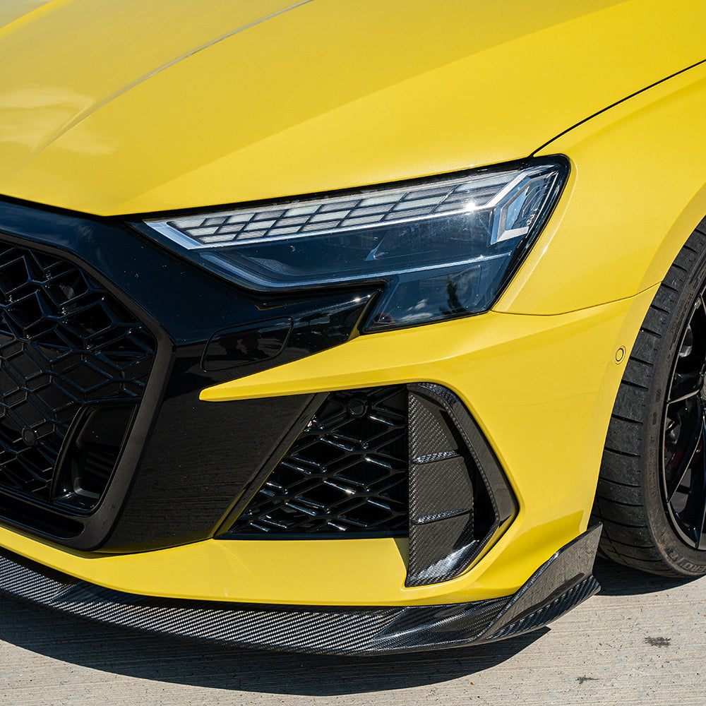 Audi RS3 8Y 2025+ carbon fibre splitter by CT Carbon, showcasing sleek aerodynamic design on the front of the vehicle.