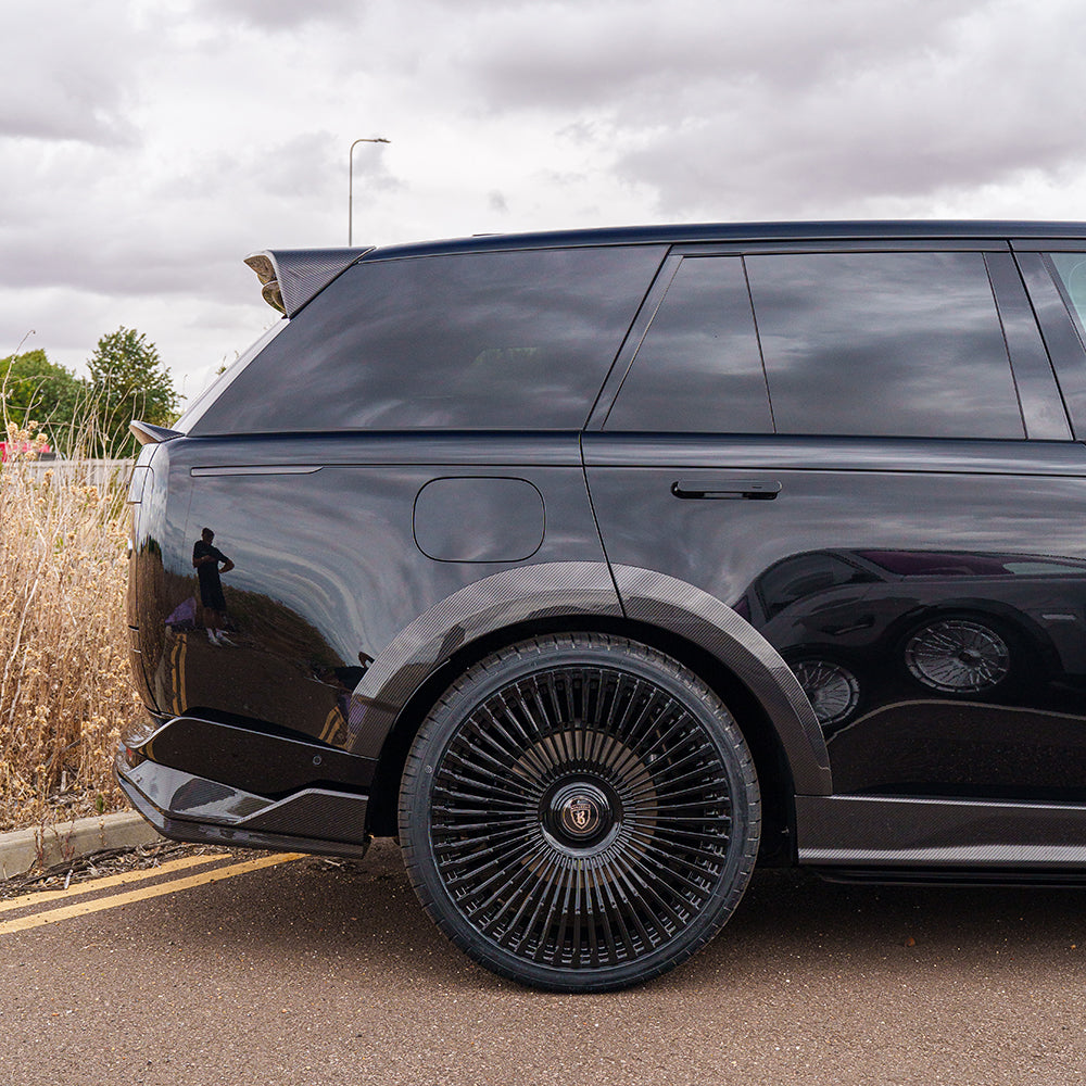 Carbon fibre roof spoiler for Range Rover L460 2022+ by CT Carbon, showing sleek aerodynamic design on a luxury SUV.