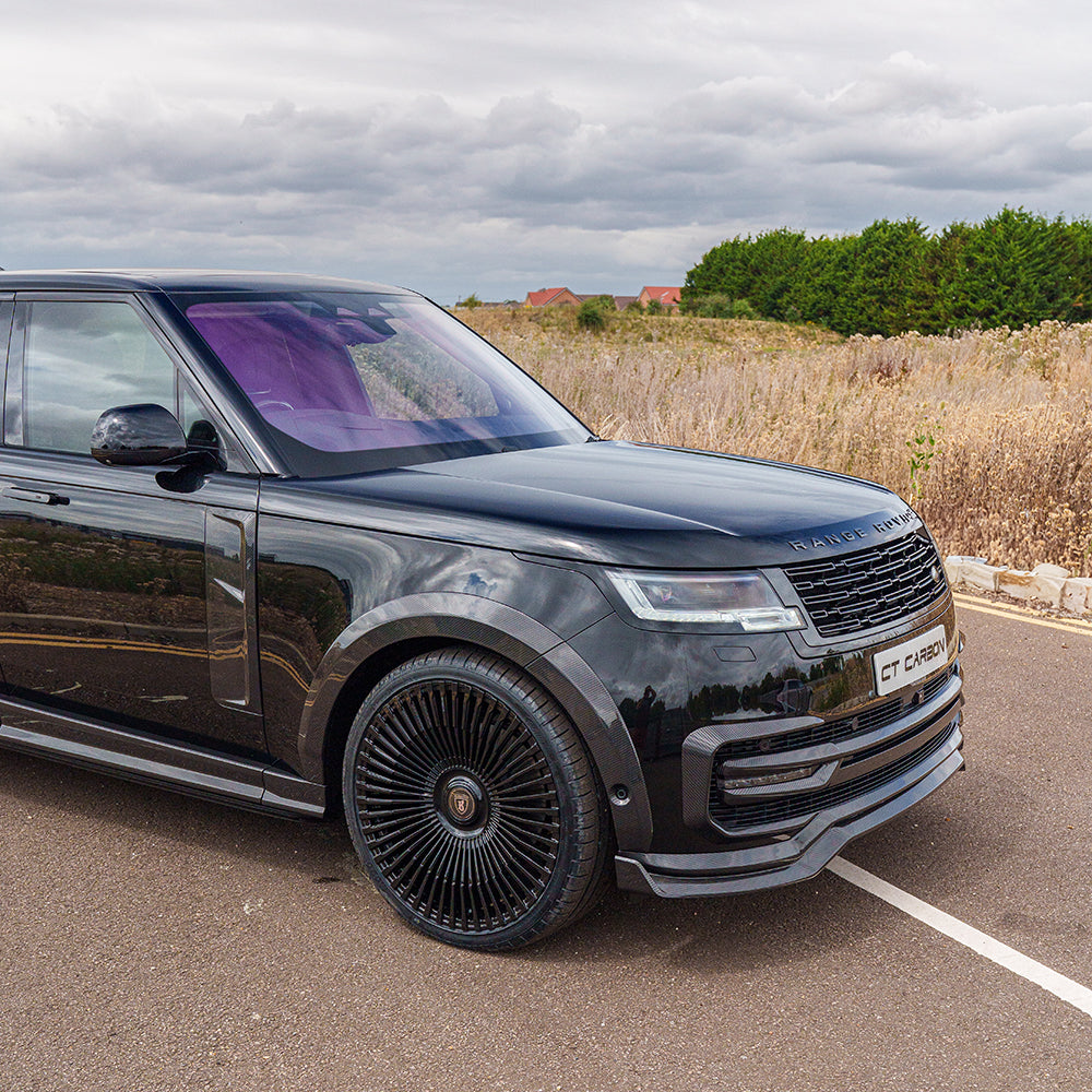 Range Rover L460 2022+ carbon fibre wide arch extensions by CT Carbon, showcasing sleek, textured car arches on a luxury SUV.