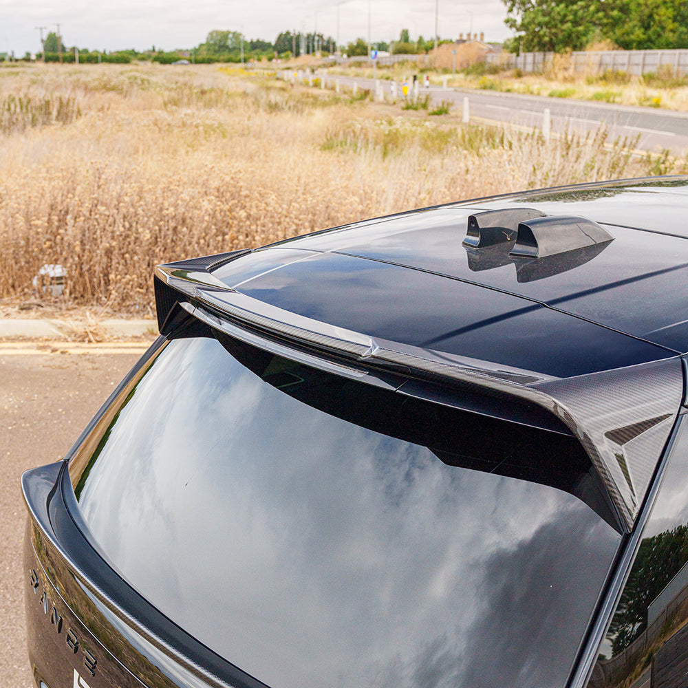 Range Rover L460 2022+ carbon fiber roof spoiler by CT Carbon, sleek aerodynamic accessory for enhanced vehicle style.