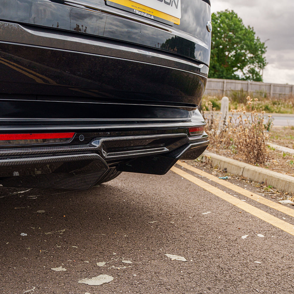 Range Rover L460 2022+ CT Carbon fiber diffuser, designed for the vehicle's rear, featuring sleek carbon fiber finish.