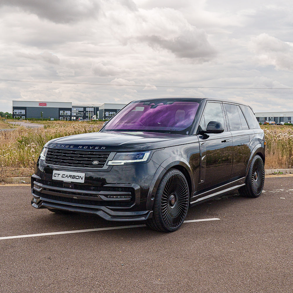 Range Rover L460 2022+ CT Carbon carbon fiber diffuser showcasing sleek design and textured finish for enhanced vehicle aesthetics.
