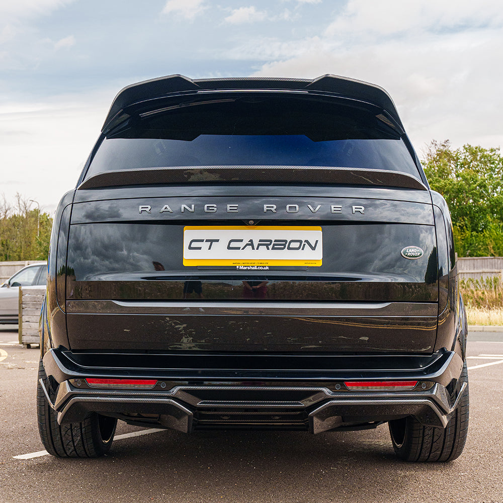Range Rover L460 2022+ carbon fibre diffuser by CT Carbon, showcasing sleek design and textured finish on the vehicle's rear.