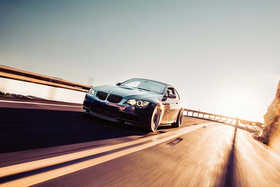 ST Suspension coilovers with adjustable damping and top mounts installed on a BMW E92 M3, showing the coilover setup and suspension components.
