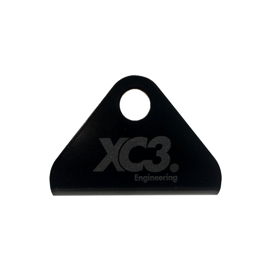 XC3 Engineering seat belt and harness mounting bracket for vehicle interior safety, shown in black with mounting points.